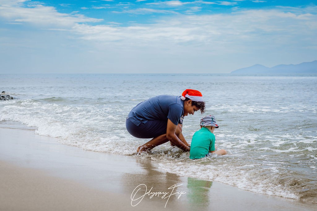 An Odyssey guide with a young guest at the waterline