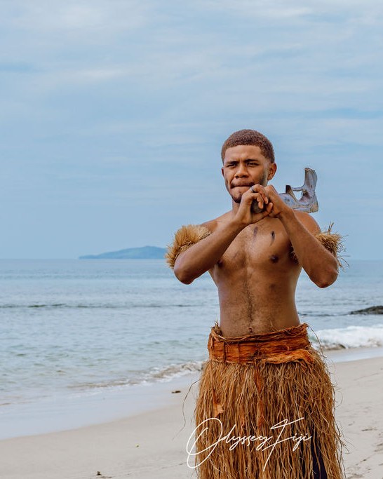 A traditional Fijian warrior welcome on the beach